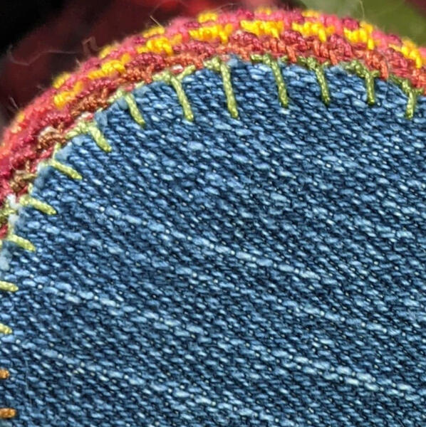 Donna makes bags for her thread with knotted lace.