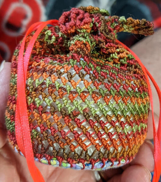 Donna's knotted lace bags. She gets a lot of practice with tension.