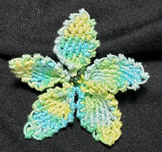 Florence's beautiful pinched flower she made from the intermediate advanced patterns after learning the basics in the virtual class with the Lace Museum in Sunnyvale, California.