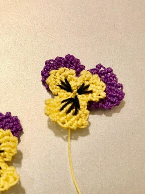 Paula Harten's small violas from the intermediate virtual class with the Lace Museum. She is a board member of the Lace Museum and enjoys bobbin lace, needle lace, and finger lace.